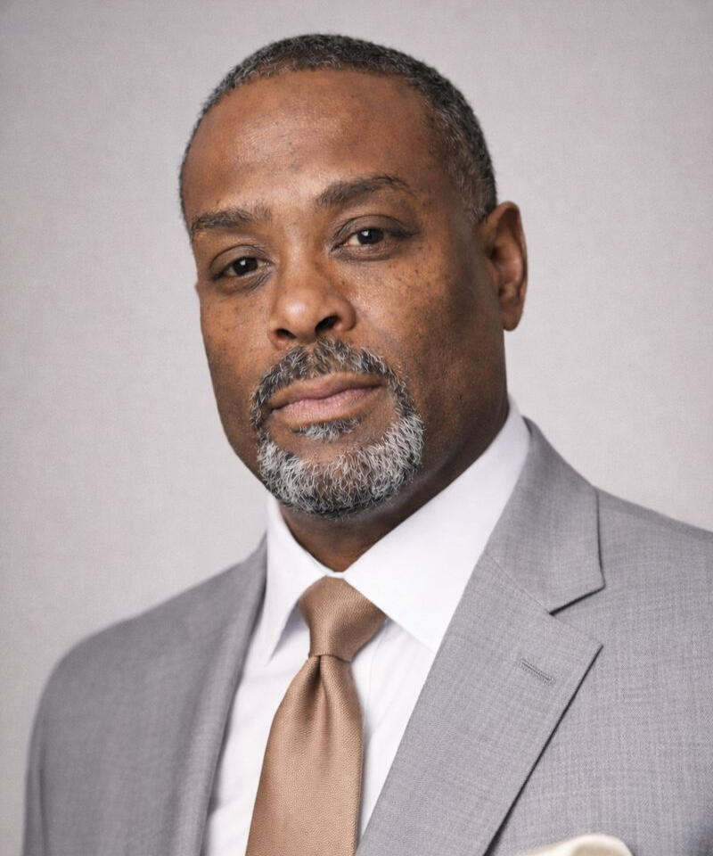 Black professional male relaxed posing